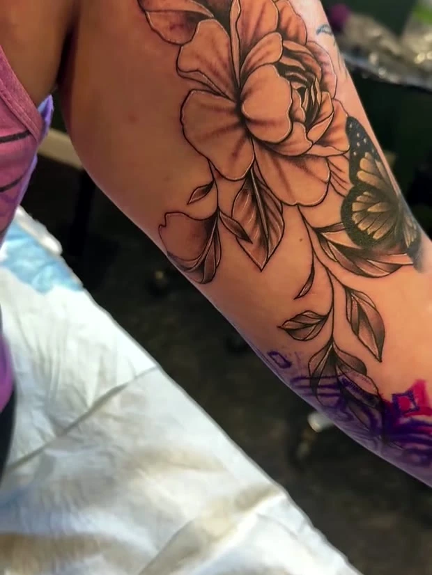 Peony forearm, tattooed by Jordan