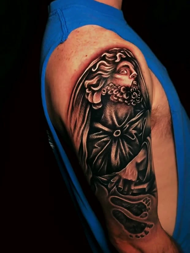 Black and grey realism shoulder piece, tattooed by Jordan