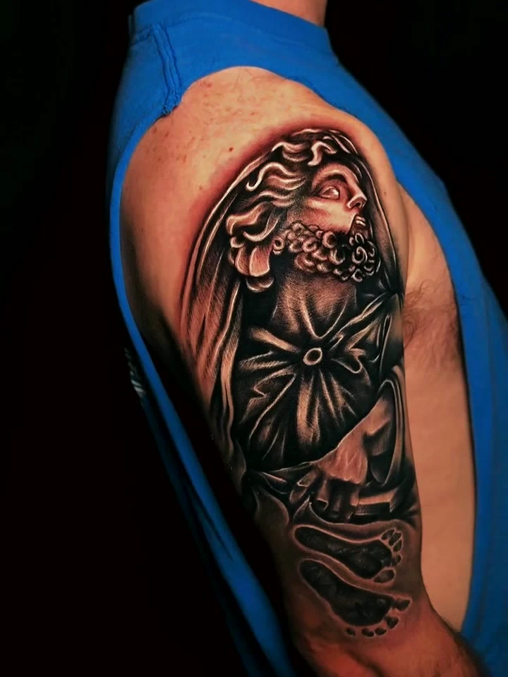 Black and grey realism shoulder piece by Jordan