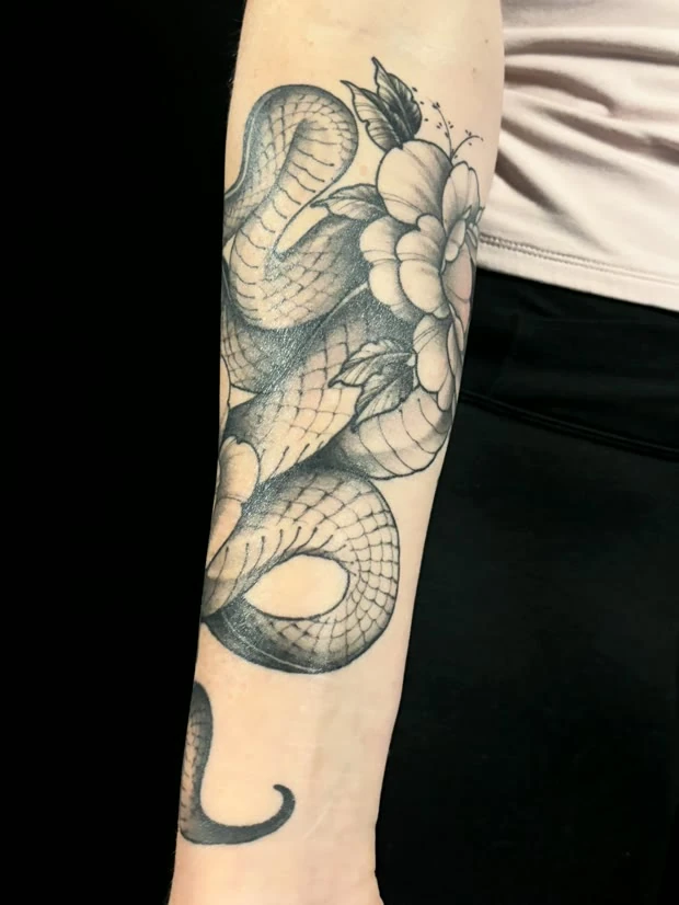 Snake and peony forearm, tattooed by Tevin