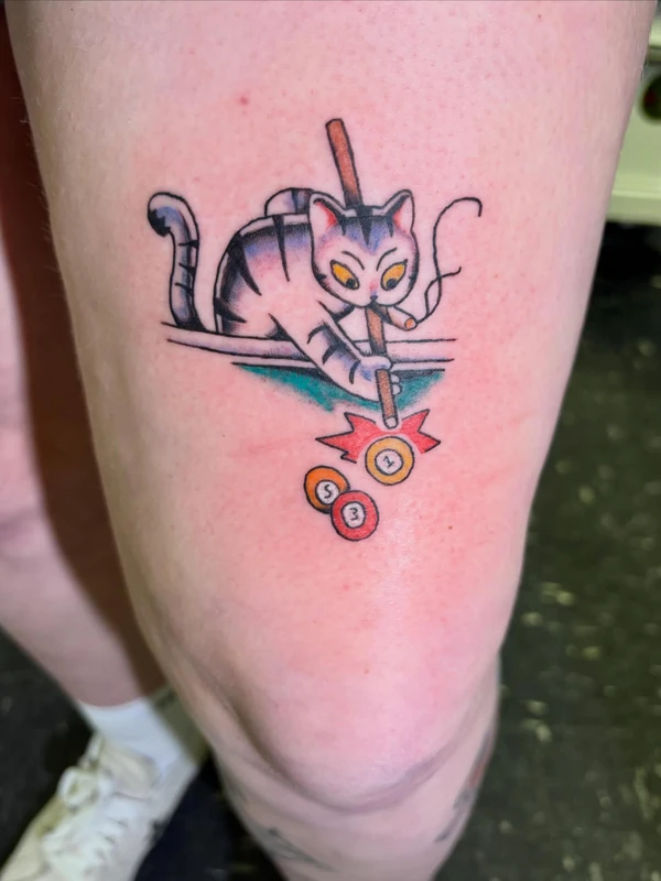 Cat in bold color, tattooed by Cara