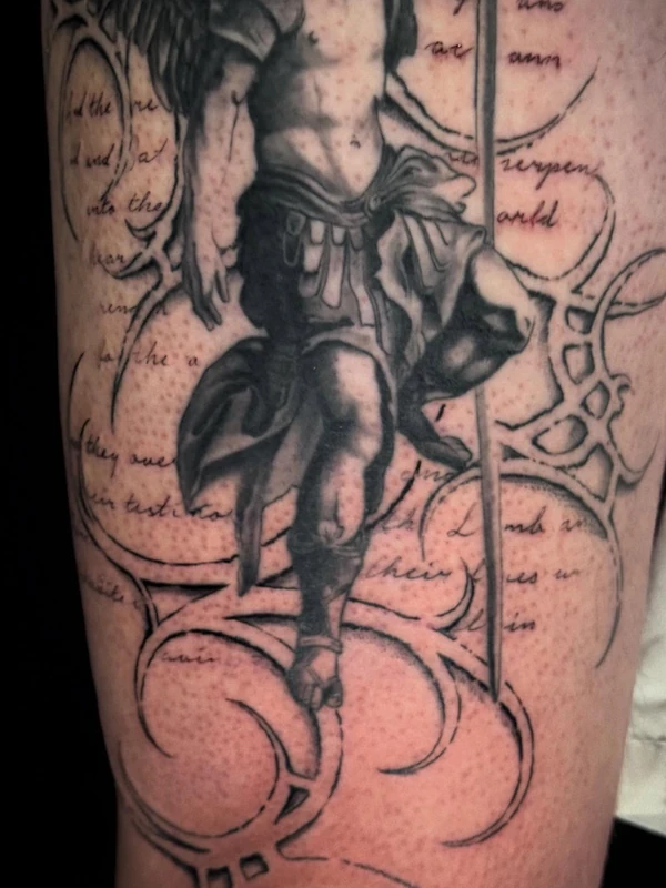 Cherub with script and filigree, tattooed by Tevin