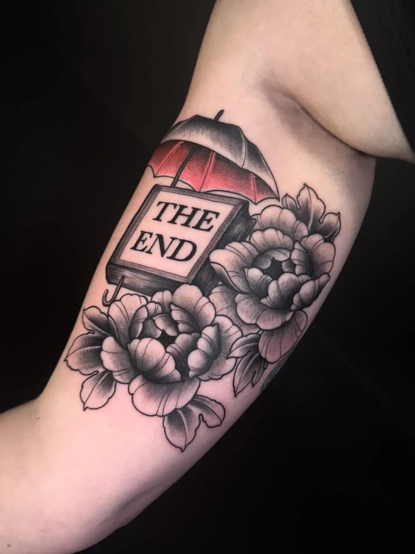 The End book with peonies, tattooed by Tevin